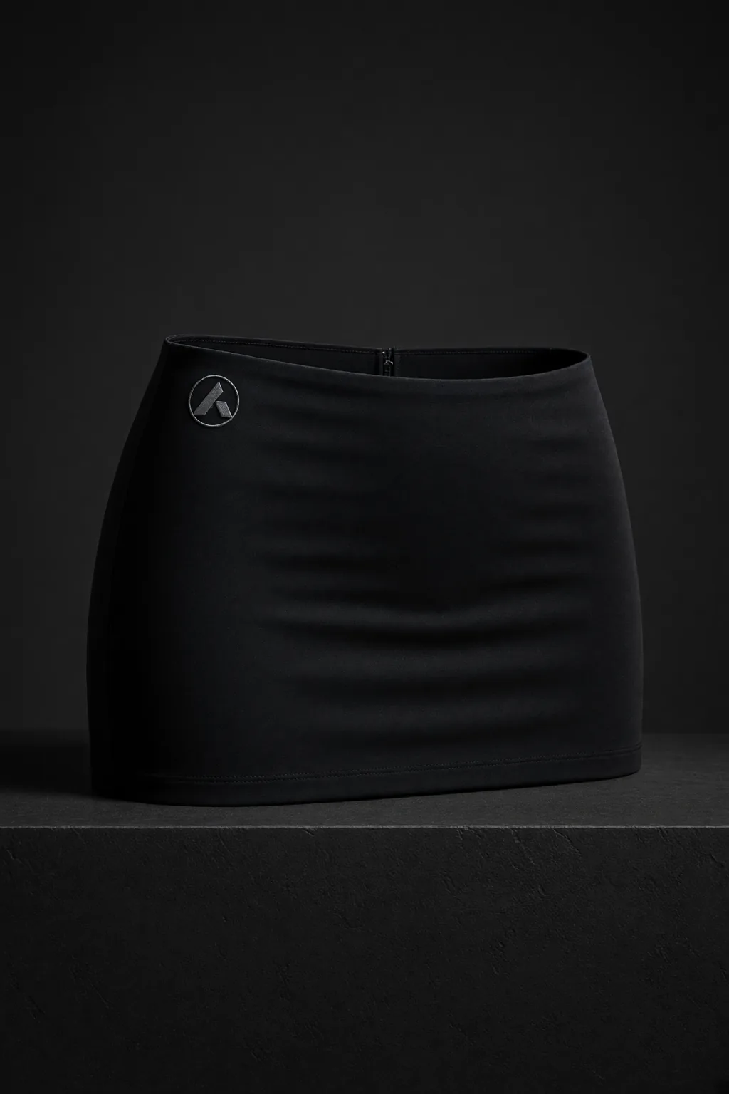 Awning, Ultra-low-rise micro miniskirt with a shallow V waist, close hip and one precise architectural flare